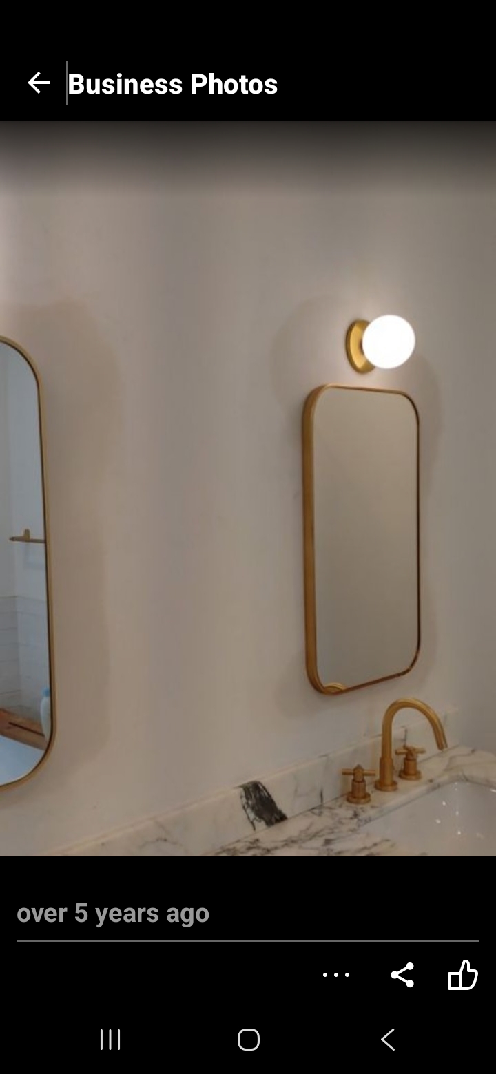 Finished bathroom with gold fixtures
