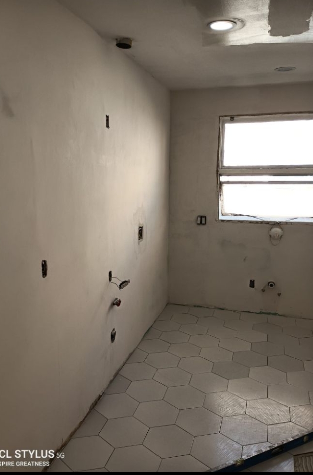 Bathroom with hexagon flooring in progress